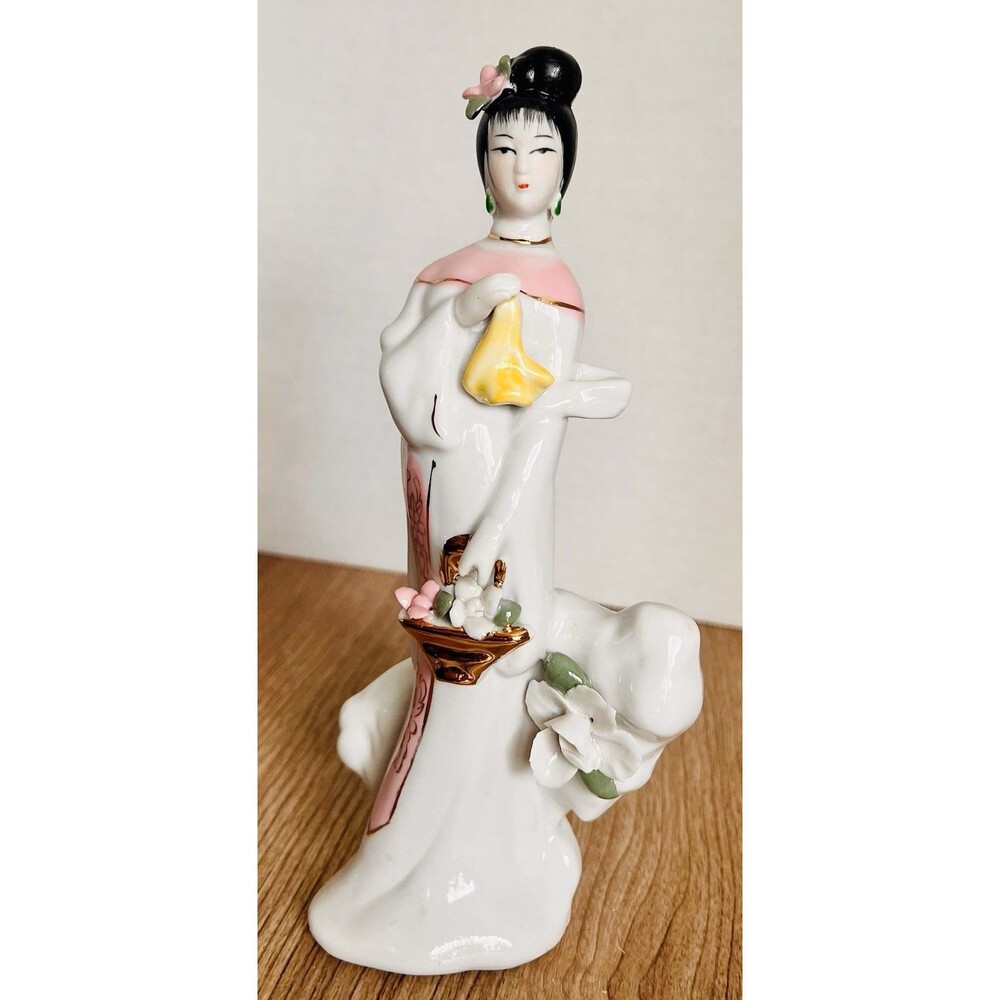 Vintage  porcelain geisha figurine hand-painted details, and gold accents 8.5”